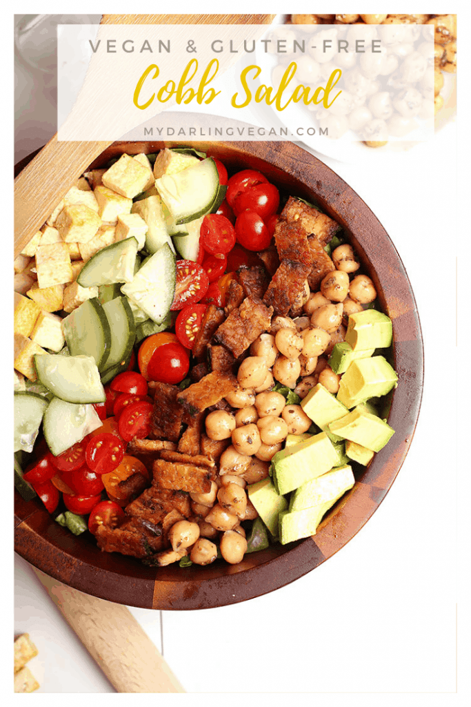 This Vegan Cobb Salad has it all! It is made with tempeh bacon, chicken-spiced chickpeas, eggy tofu, avocado, cucumber, and fresh tomatoes all served over a bed of fresh Romaine lettuce. Enjoy for a hearty lunch or light and refreshing dinner. 