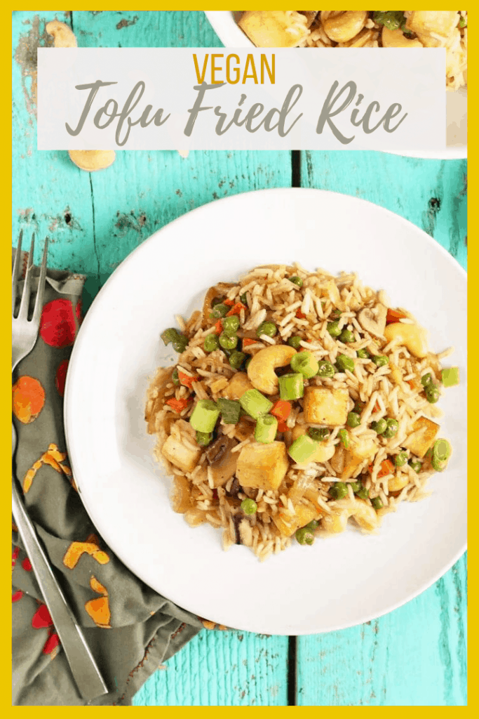 Make take-out at home! This Tofu Fried Rice is made with crispy tofu, carrots, peas, and cashews for a hearty and delicious plant-based and gluten-free meal the whole family will love.